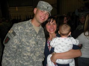 Jon and Kristin with baby Elanie, arriving home from Iraq; Army